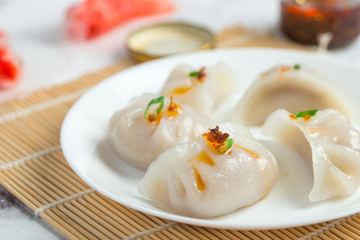 Crystal dumplings with minced pork filing, served with XO sauce