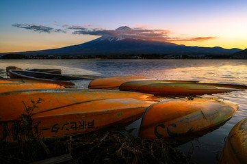 Fototapeta premium Landscape of Fuji Mountain with Beautiful Autumn Leaves. Iconic and Symbolic Mountain of Japan. Scenic Sunset Landscape of Fujisan at Evening Time, Kawaguchiko, Yamanashi, Japan.