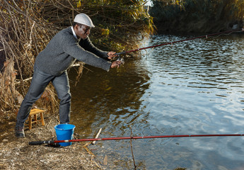 Man standing with fishing rod