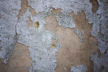 A old wall with cracks for background.Composition with concrete cement wall with crack in industrial building, Will be good for your design and texture background