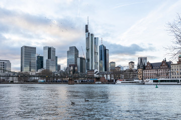 Frankfurt skyline view from main river at sunset 