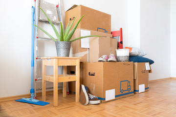 Move. Cardboard boxes, cleaning things and stuff for moving into a new, clean and bright home