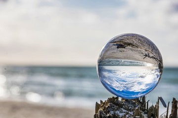 lensball at the beach - look through a lensball at the baltic sea - photography accessories