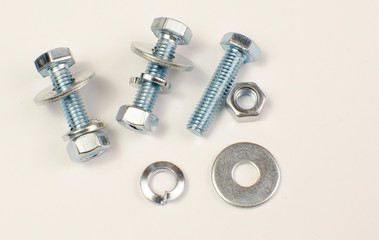 bolts and nuts, car washers on a white background