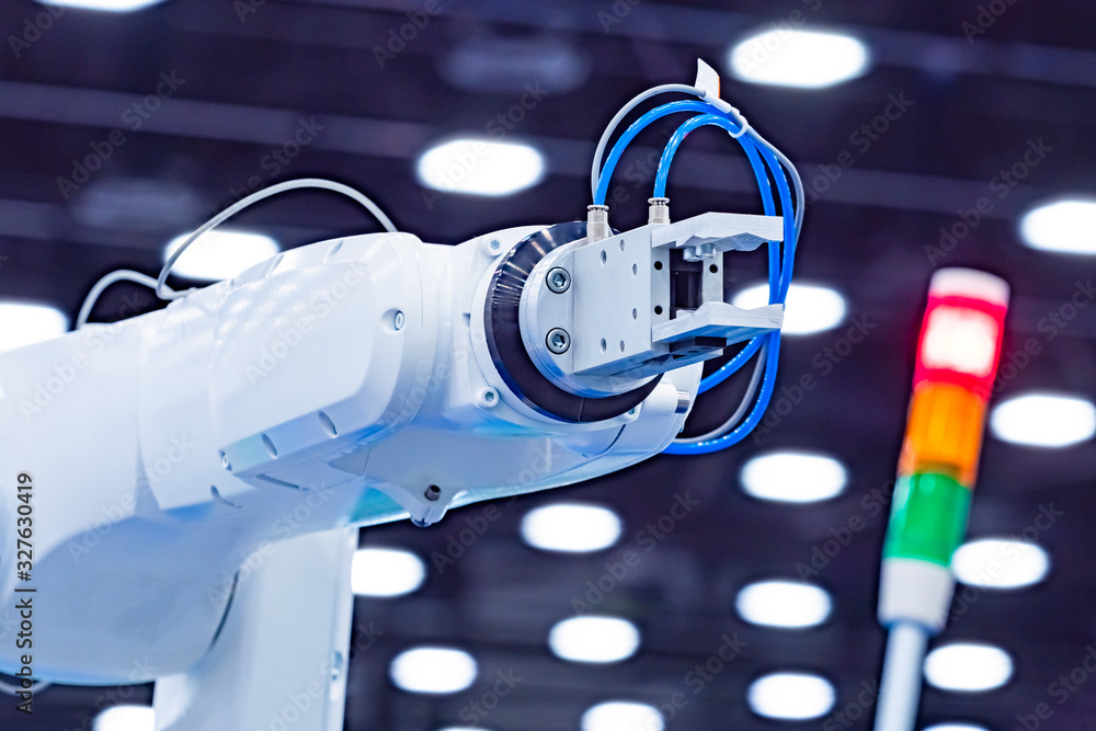 Poster hand is a manipulator. industrial robotic arm. using the robot in production. robotic plant. robotic