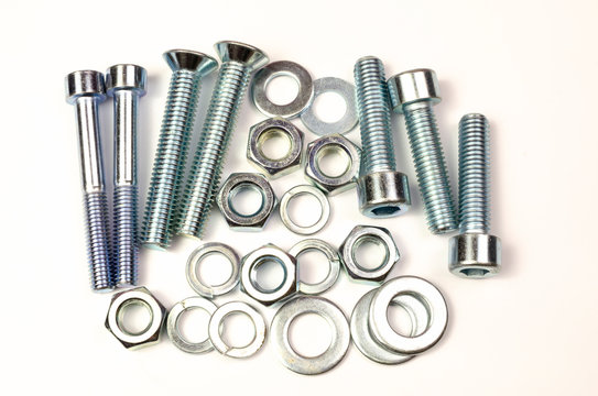 Several Automotive Fasteners Parts On A White Background