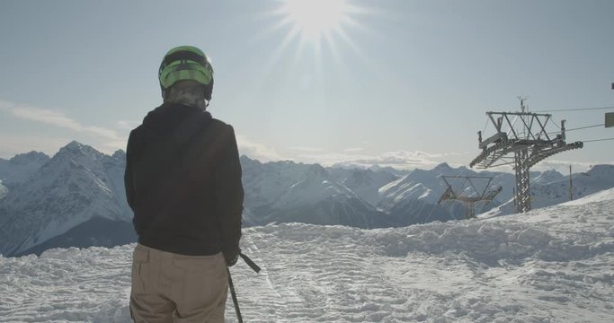 Skier skiing in the swiss alps, near st. Moritz, on a beautiful sunny day with blue sky.
