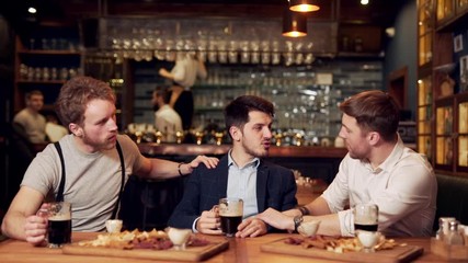 friends guys support their friend at the bar
