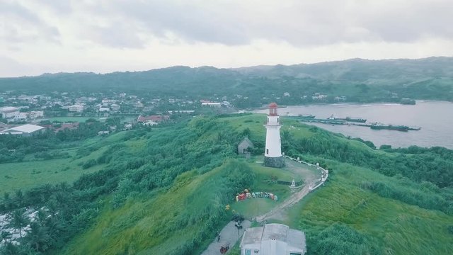 Cinematic aerial drone video of a romantic lighthouse of Basco Batanes in the Philippines.