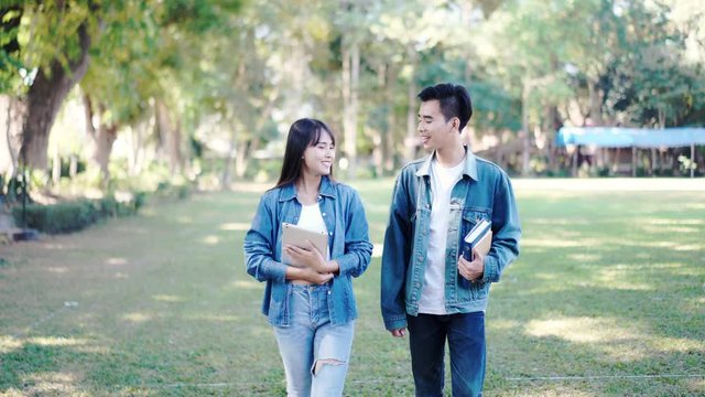 University Education learning abroad international ,Young students Asian teenager smile with Notebook, tablets school folders reading book at high school university campus college study learning