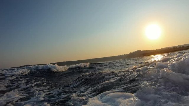 Sunset cruise in Ayia Napa Cyprus.  Summer Holidays. Ocean sunset.  Sunset waves forming