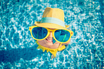 Happy child in swimming pool