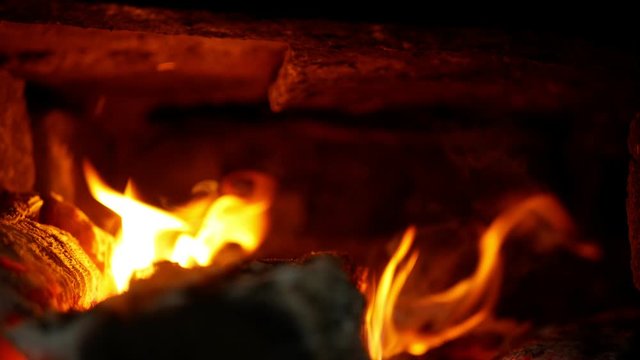 Smokehouse is a fire in oven and furnace made of beech and ash wood. Beautiful red flames smoke. Chamber of stoves made of stone and concrete, traditional folk buildings construction