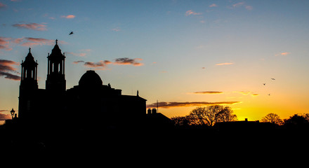 sunset behind church