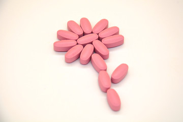 Vitamin Complex Colorful pink pills. Doctors for advertising health. Medical picture.