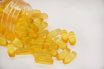 Fototapeta premium Fish oil capsules with omega 3 and vitamin D, healthy eating concept