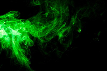 Green smoke on black background