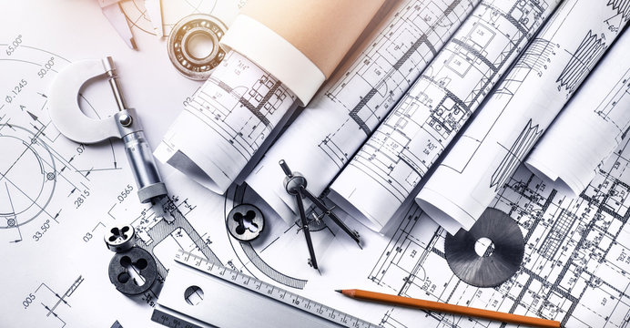 Technical drawings with measure tools. Pencil, measurement. Papers with technical drawings and diagrams on the table...C