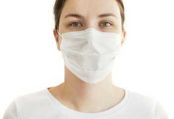 Young Woman in Face Mask. Coronavirus COVID-19.