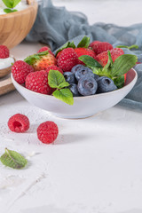 Berries for healthy breakfast. Bowl of raspberry, blueberries and strawberries