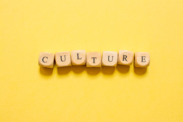 the word Culture, text made with dice on yellow background