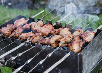 shish kebab on skewers on the grill. Close up
