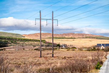 Fototapeta na wymiar Typical power lines in rural landscape of Ireland