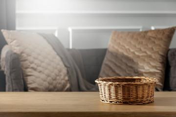 Fototapeta premium Still life details of the home living room interior on a wooden table with free space for an advertising product for Easter