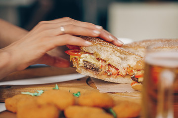 Woman hand hamburger