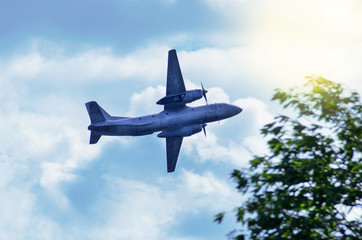 Airplane on a background of blue sky at dawn with copy space.