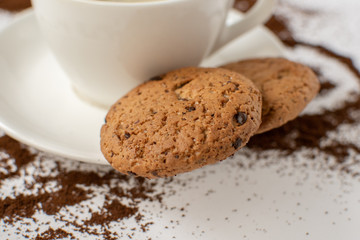 Espresso coffee on a white background with cookies. Still-life. Selective focus.