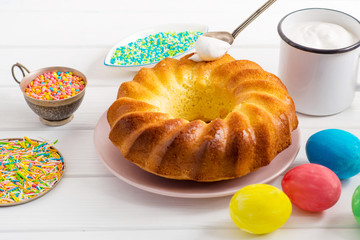 making Easter cake, cream for Easter, Easter eggs