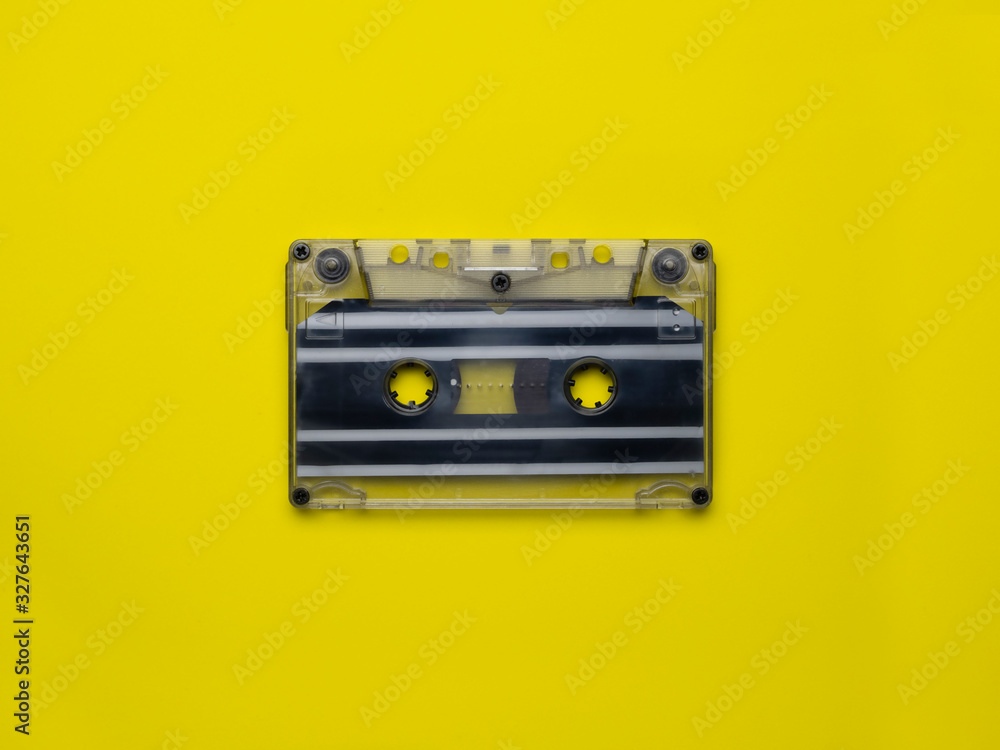 Wall mural retro cassettes on a yellow background. view from above. copy space