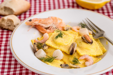 Ricotta sorrentinos with seafood cream