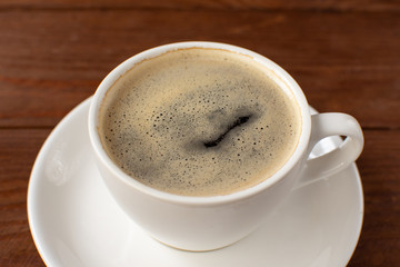 Espresso coffee on a wooden background. Still-life. Selective focus.