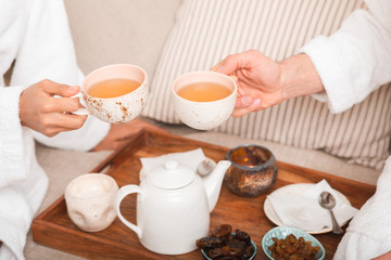 drink healing tea after massage at resort and spa salon.