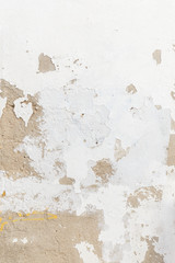 Close-up of a weathered and old concrete wall, white paint has peeled off. High resolution abstract full frame textured background.