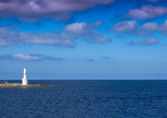 Fototapeta premium White lighthouse in La Savina, Formentera island, Balearic, Spain