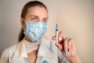 Female doctor wearing protective blue mask