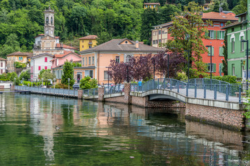 Lakefront of Porto Ceresio with flowers and colored houses