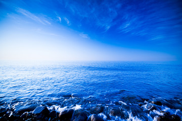 Cool mesmerizing and beautiful seascape over the sea of rocks against a sky-blue horizon and clouds...