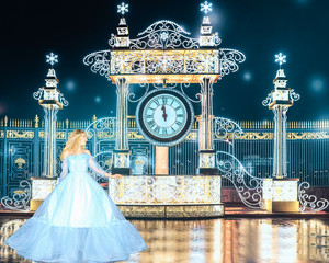Beautiful princess in blue long dress runs away from the queens ball when the clock is struck 12pm....