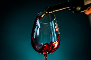 red wine pouring into glass
