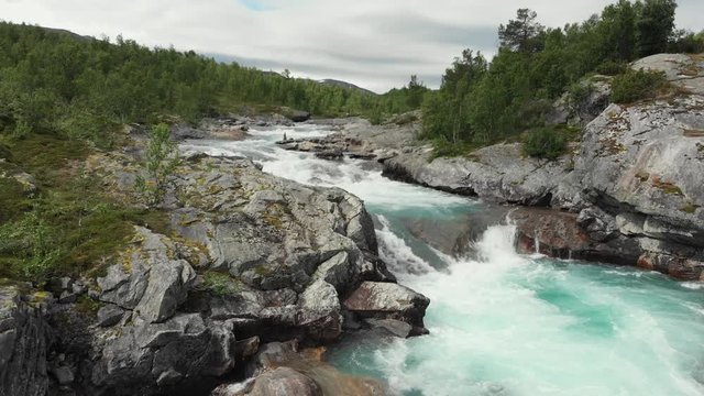 Beautiful wild river called Otta in Norway.
Filmed with drone, fly away from waterfall.