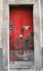Old and colorful wooden door with iron details