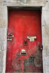 Old and colorful wooden door with iron details