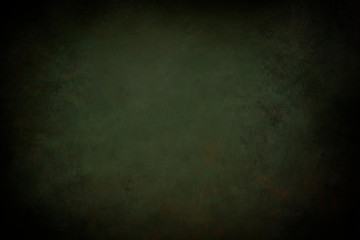 dark green grunge background with black vignette borders