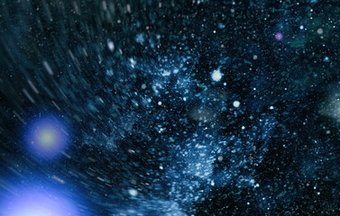 Cosmic pattern with soft blur on dark background, suitable for desktop wallpaper or for creative...