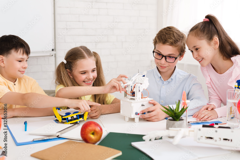 Aufkleber Early development concept. School children creating robots
