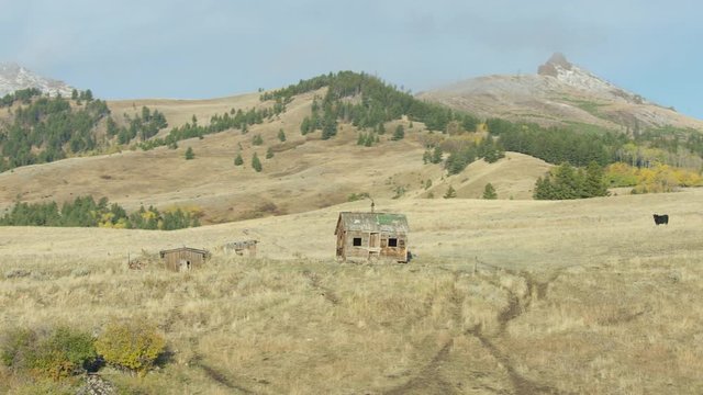An abandoned mountain cabin sits in the foothills of the Gallatin mountain range in southwestern Montana